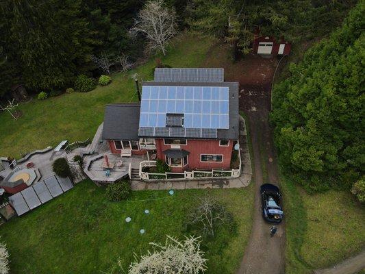 Roof mount solar array with elevated racking system on the north face