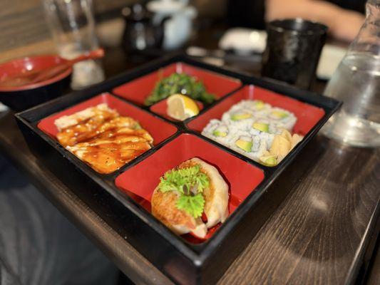 Four item combo with gyoza, chicken teriyaki, California roll, seaweed salad.
