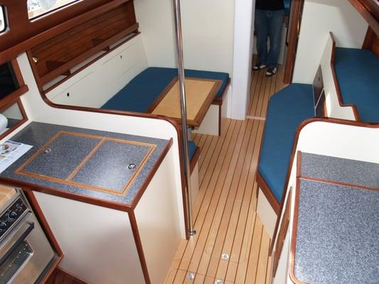 Renovated sailboat interior with maple and koa flooring.