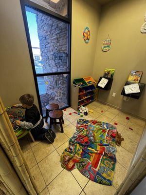 Kids play area right next to the front desk!