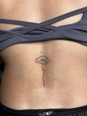 Fine line poppy flower tattoo