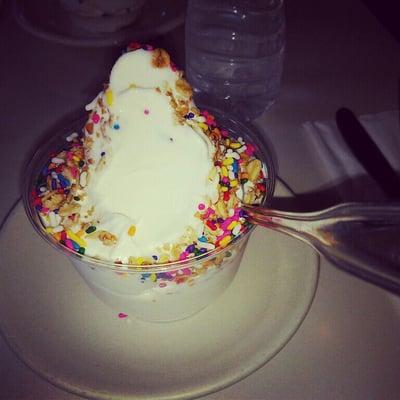 Yummy vanilla frozen yogurt with rainbow sprinkles & granola