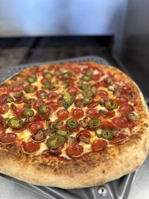 Pep, sausage and jalapeño pie.