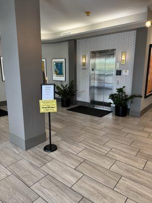 Directions to the lower level from the first floor.