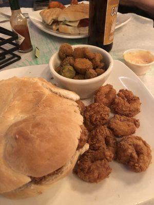 Shrimp poboy and chicken sandwich. Sides of fried okra and sweet potato waffle fries.