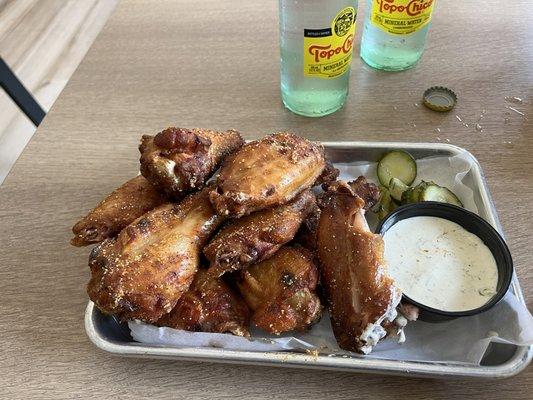 Smoked wings with fresh ranch dressing and sweet pickle slices. Da' bomb