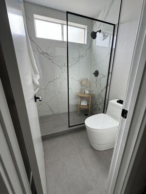 Porcelain shower and floor.