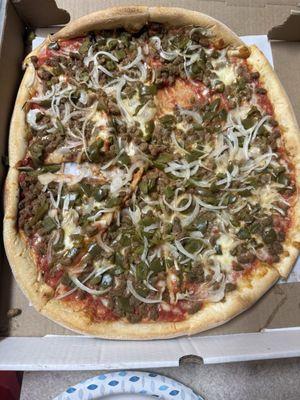 This is the pizza which they charge 3.50 each topping so 10.50 on top of the price of the pie and it comes looking like this