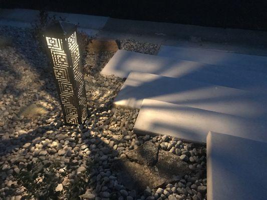 Handcrafted lighting bollards positioned to illuminate your landscape and hardscape.