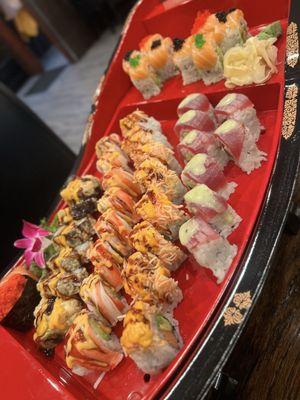 5 rolls of sushi and Spicy tuna and Salmon sashimi