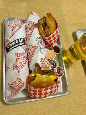 A monster Philly a regular Philly two bacon cheeseburgers and a Bruchi's Beer