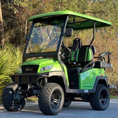 Celebratin' the season over here, with a BETTER-than-ever price on this lifted, lime green 4seater Bintelli Beyond!