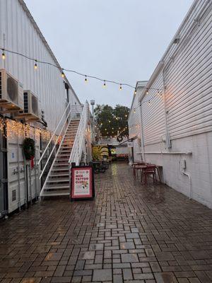 The alley where the bookstore is in the back.