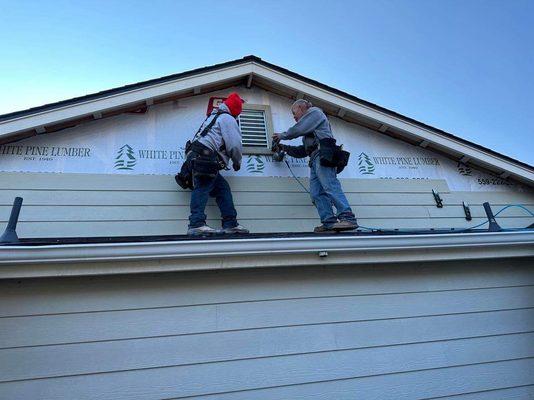 Installing 12 inch siding in Oakhurst on this beautiful home
