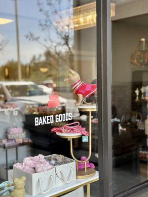 Another peek through the window into our salon in La Costa. Look at the stylish doggy apparel, accessories and toys!