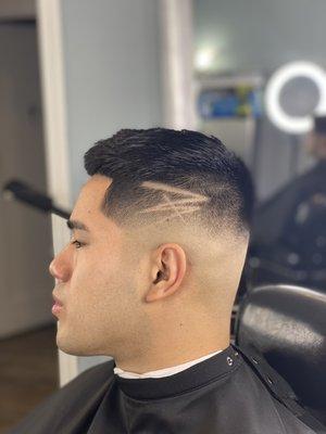 Regular medium skin fade with freestyle design