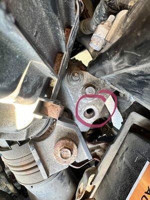 Loose bolt that they just placed there without putting on fastener.