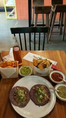 Carnitas taco ($9.00), lemon pepper chicken chicharon ($9.00) duritos & guac, & sidral munder ($2.50)