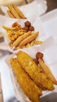 Whitings, snow leg sticks, shrimps, fries, and hushpuppies