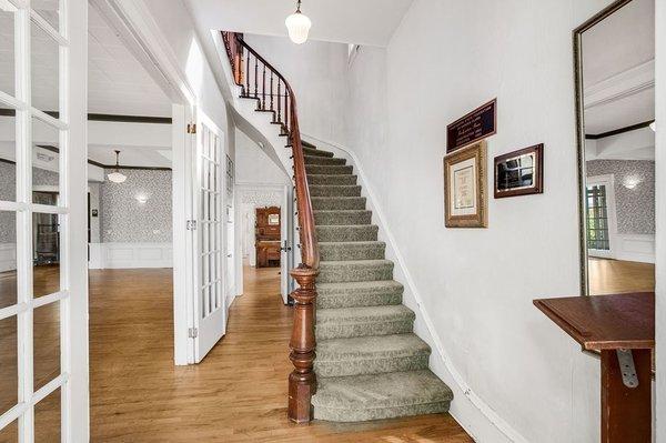 Grand entrance to beautiful antique stairs