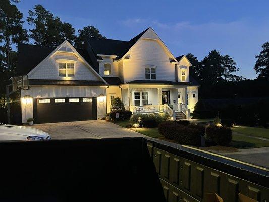 Gorgeous home with up lights and down lights.