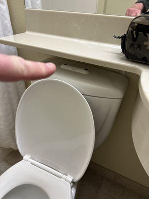 Shelf is built over the toilet level