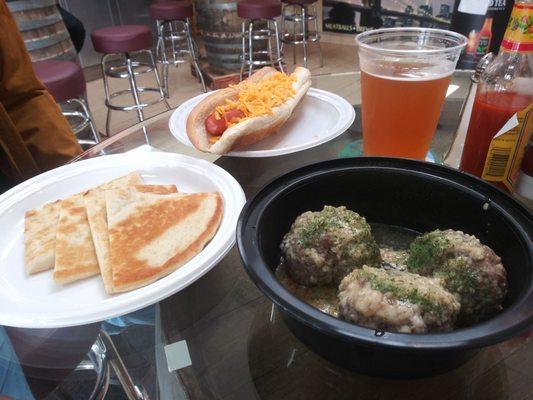 Foot long cheddar dog and Beef Meatballs with garlic parmesan sauce (came with pita). Craft beer on tap!