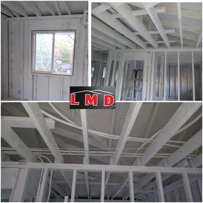 Applying  primer shellac backspary to seal the smoke odor