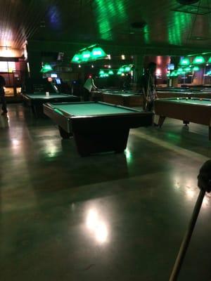 One side of the bar with lots of pool tables. More on the other side.