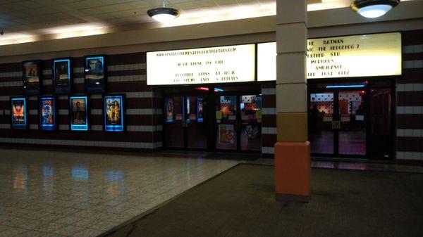 Inside the mall, front of the movie theatre.