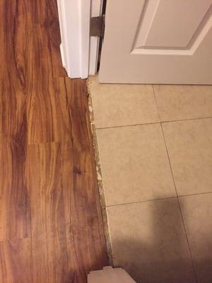 The fab between the bathroom and hallway that Abbey floors would not fix