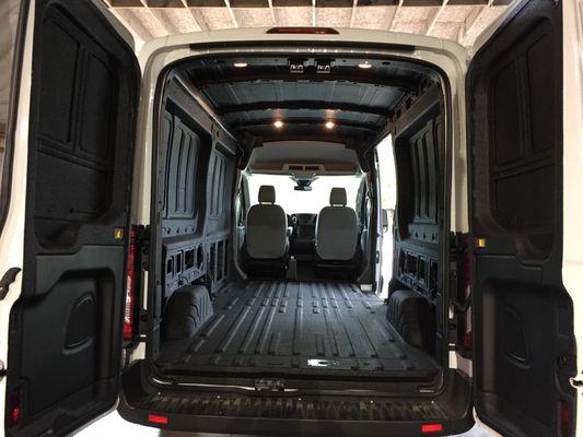 Cargo van with protective coating sprayed on the inside on walls, floors and the ceiling.