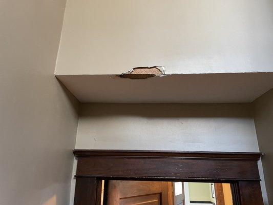 This is one of the spots they damaged the plaster in my staircase.