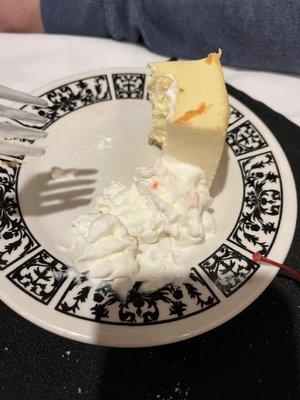 Cheesecake with whipped cream and a cherry. It was almost gone before I remembered to take a photo!