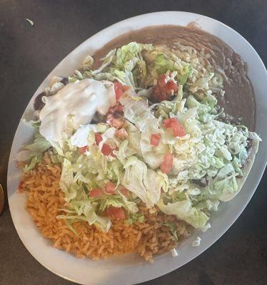 Burrito supreme lunch special . Shredded chicken- delicious !