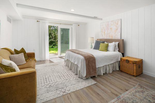 One of our earlier remodels, we remodeled a basement with fresh LVP floors, new electrical, lighting, millwork, and fresh paint.