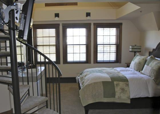 Loft Suite 303 with main level king bed and full-sized futon in the loft.