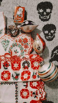 Vintage hankies, pin, matches and ornaments.