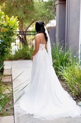 Jeanetta added thin straps to the dress that matched the color of it as it was originally strapless.