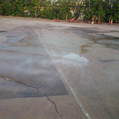 A cleaned area for a Tractor / Trailer to park in-line with dock receiving doors. Pressure Wash.