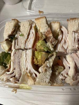 Club sandwich that appears to have been made some number of days ago. Awful food.