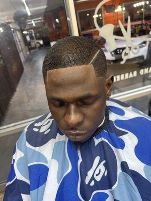 Men dark brush cut with part