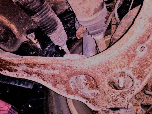 Control arm rusted completely through.
