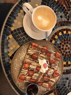 Large latte with waffles; strawberry, banana and nutella topping.