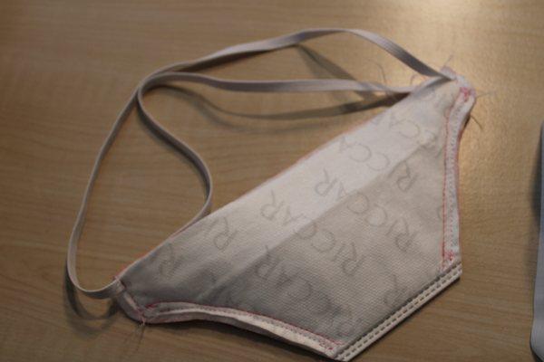 All you need is a HEPA vacuum bag, elastic, thread, and a sewing machine to make this masks.