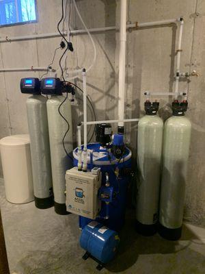 Whole house Water filtration including a radon water unit and arsenic absorbers