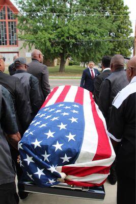 Military burial services arranged by funeral home.