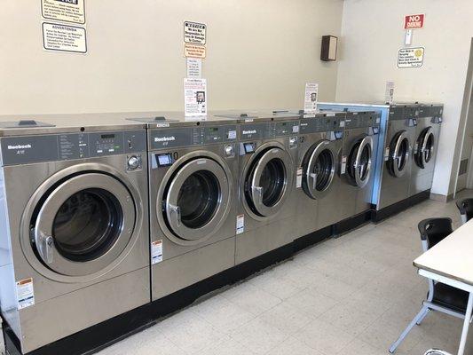 We have five 4 Load / 40 pound washers and two 6 Load / 60 pound washers. You can use credit cards or quarters on these machines.