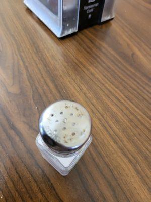 This salt shaker is pretty much a reflection of the restaurant and staff.