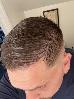 Clean fade into a comb-over. Really happy with the way it turned out.
